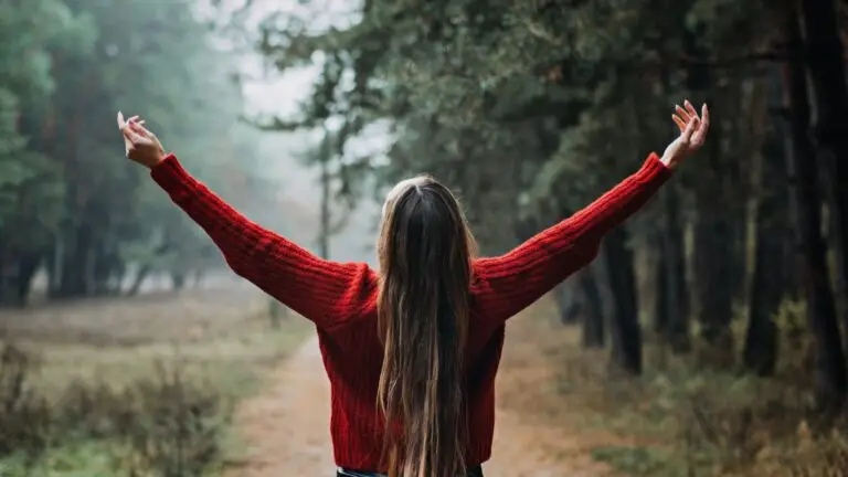Blog 2 Person with arms raised in nature